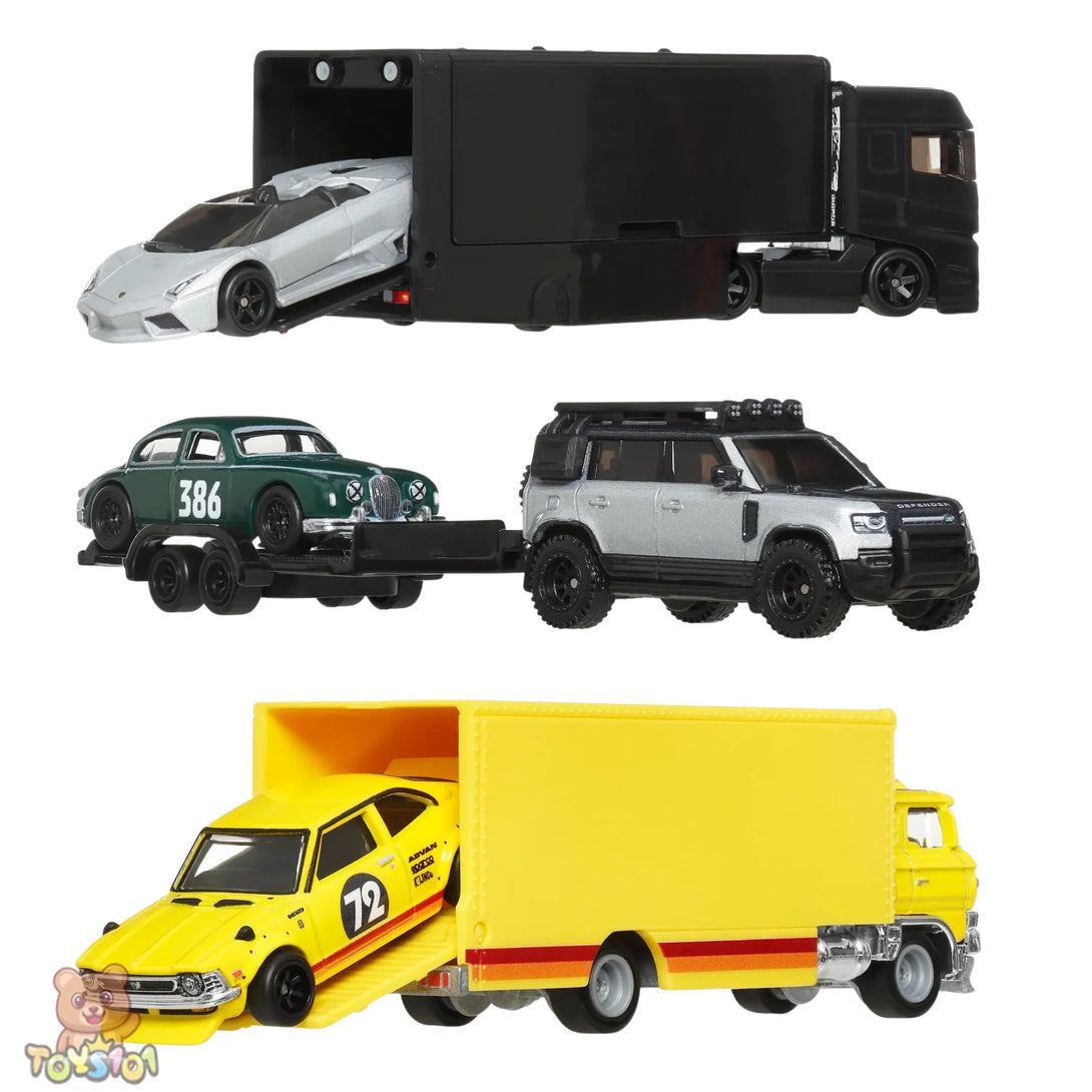 Collection of toy vehicles including a black truck with a trailer, a white car, a green car with number 386, a silver SUV, and a yellow truck with a car on a white background.