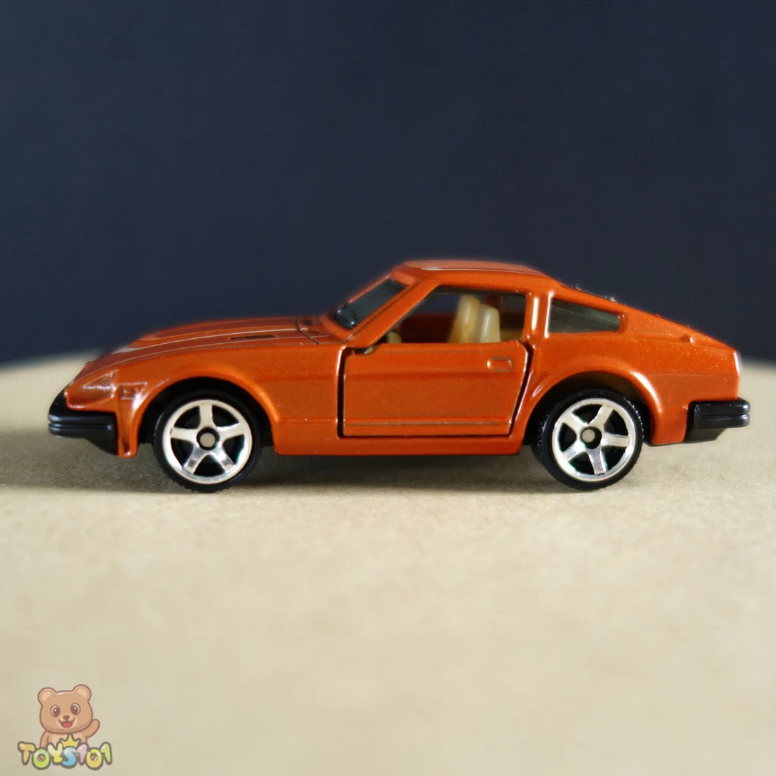 Orange 1:64 scale diecast Nissan 280ZX by Matchbox.