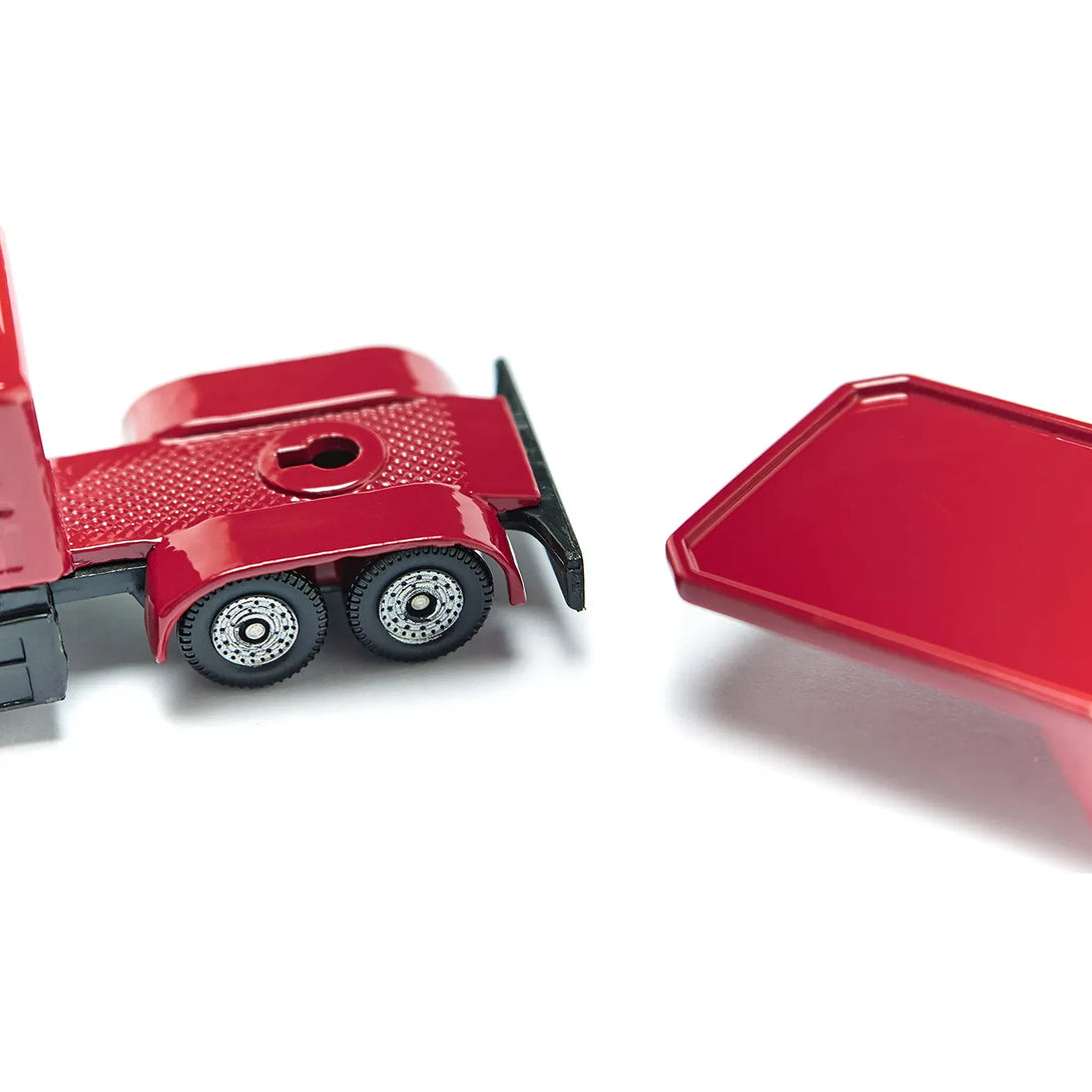 A close up of the trailer hitch on the Siku 1613 red toy truck.