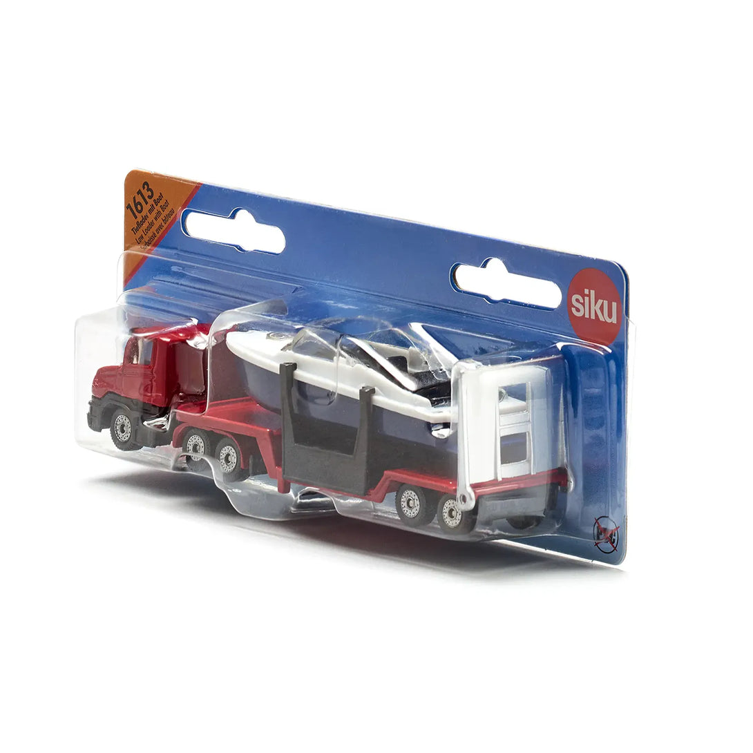 Siku 1613 red toy low loader truck with blue boat available from Toys101.