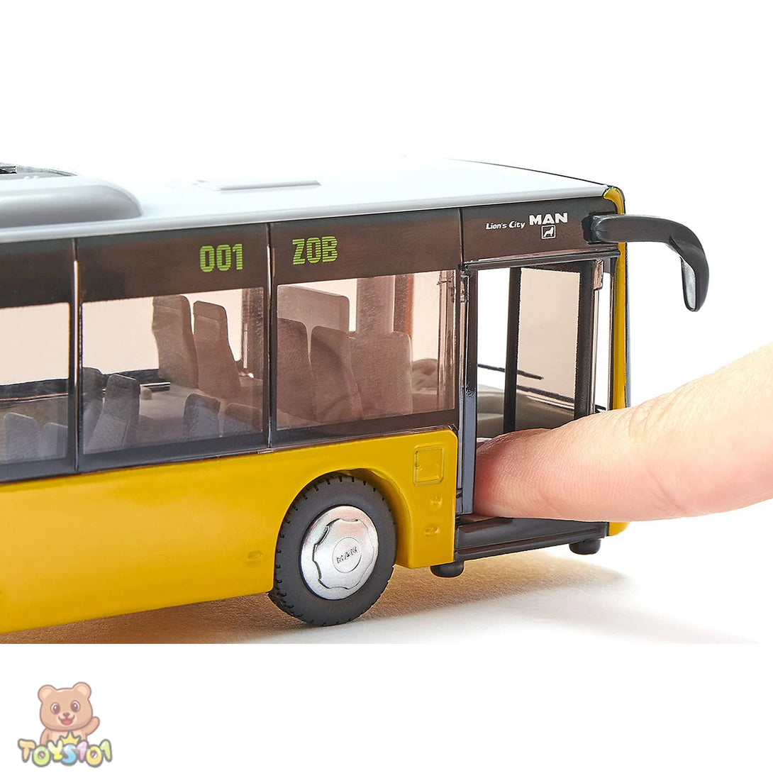 Model bus with open door, hand reaching inside, on a white background